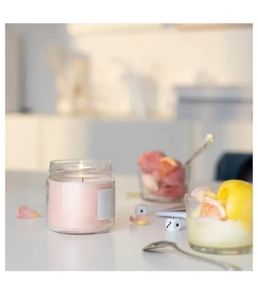 شمع معطر با ظرف شیشه ای درب دار ایکیا مدل ADELSYREN با رایحه گریپ فروت و گل رز 40 ساعتی